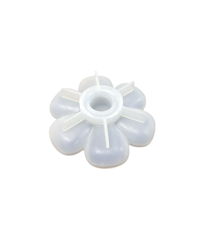 A translucent white plastic flower-shaped mold or insert with six rounded petals and a central circular opening, shown on a plain white background.