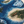 Coastal scene with blue water, sandy islands, and a small boat made using Apex Resin